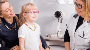 Mother and Daughter Talking With Optician